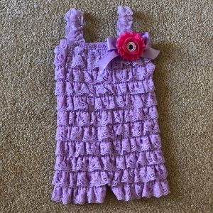 Purple lace romper for little girls.